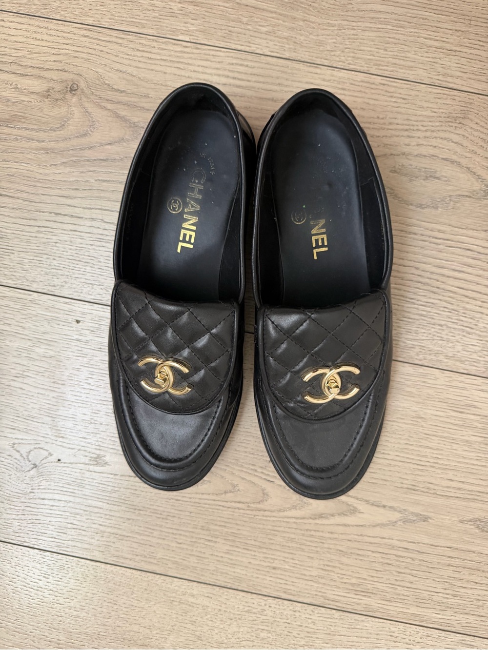 CHANEL Black Quilted Leather Slip-On Loafers with Gold CC Emblem